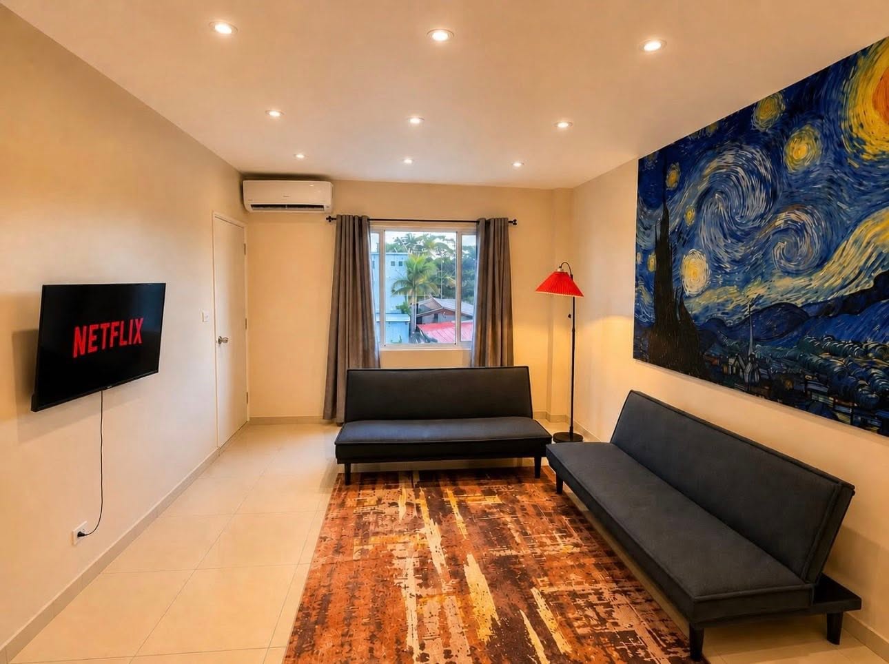 Family Apartment lounge with television and window