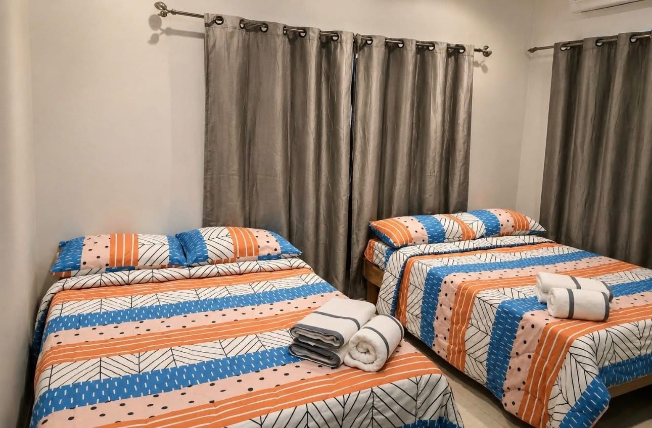 Family Apartment twin beds with folded towels