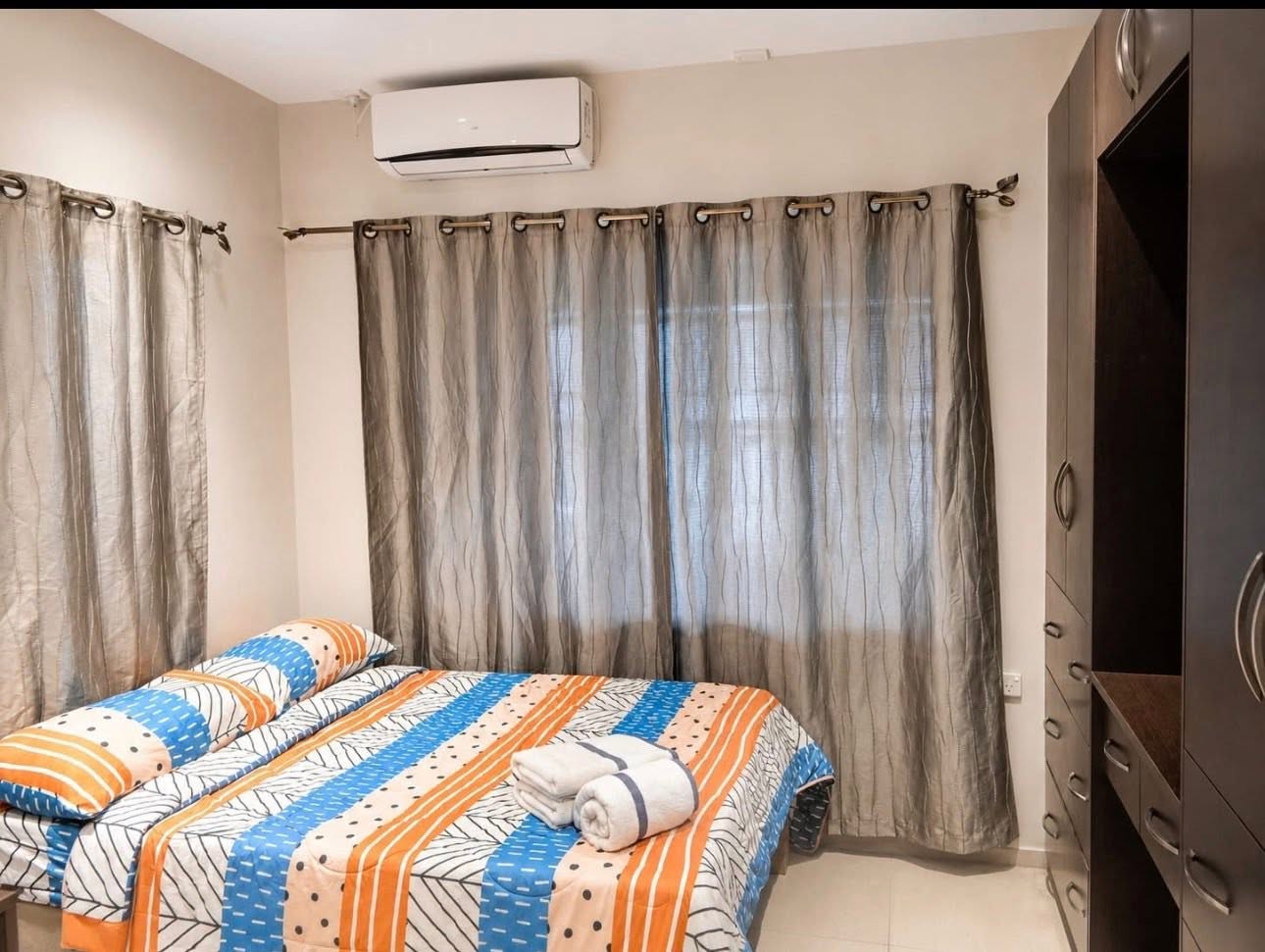 Air-conditioned Family Apartment bedroom with twin beds