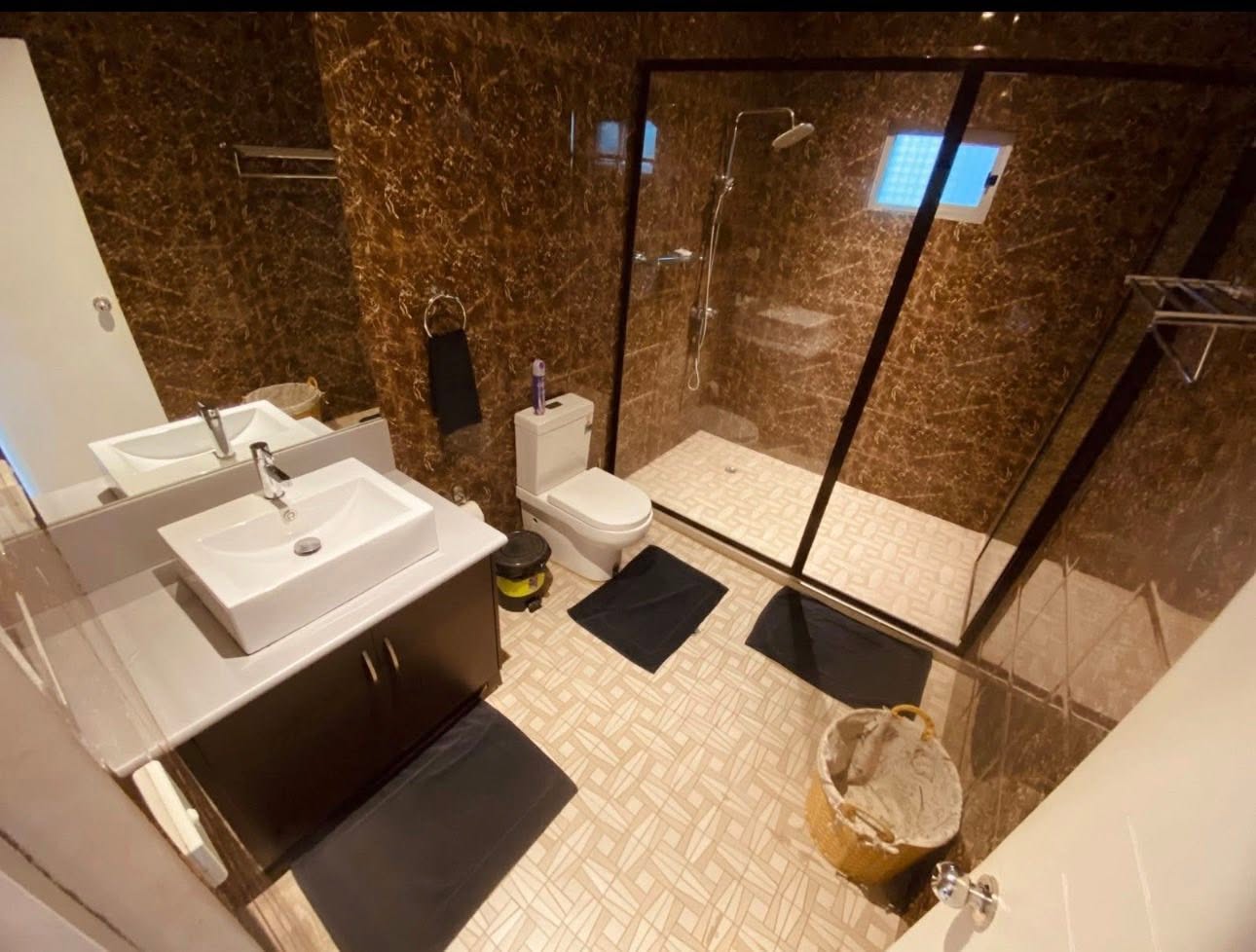 Family Apartment bathroom with double vanity and shower