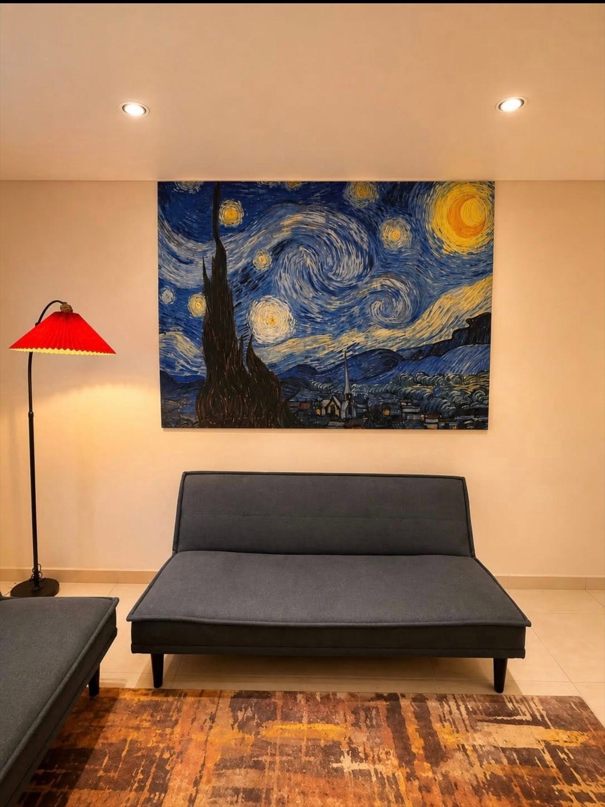 Family Apartment lounge seating beneath feature artwork