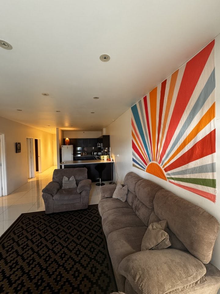 Superior Apartment living room with sofa and sunrise mural