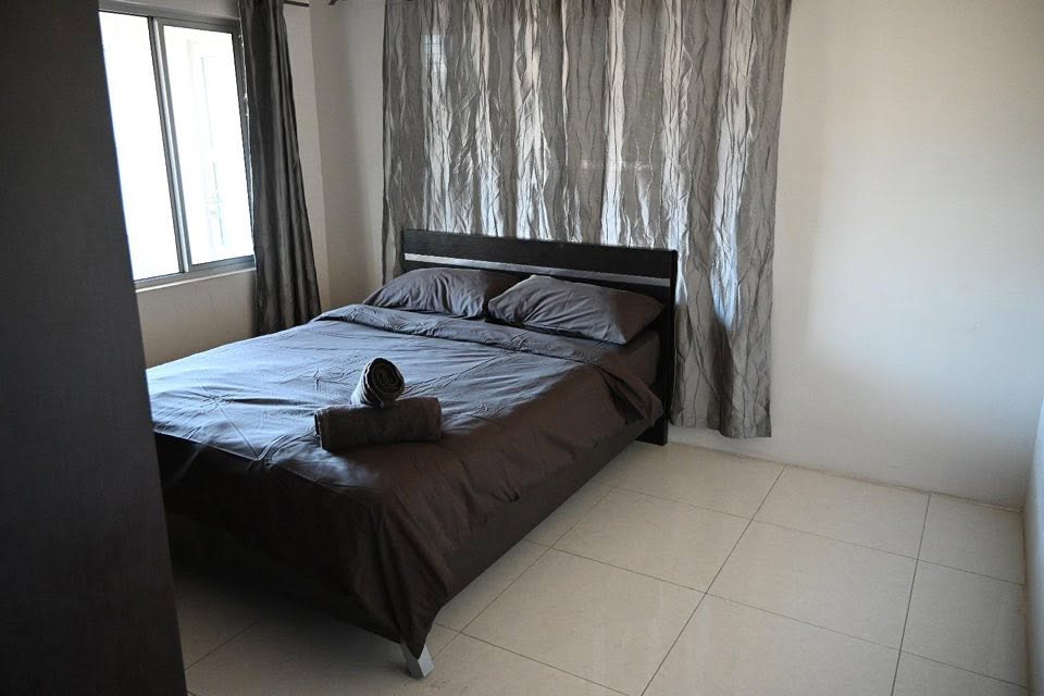 Superior Apartment bedroom with window and folded towels